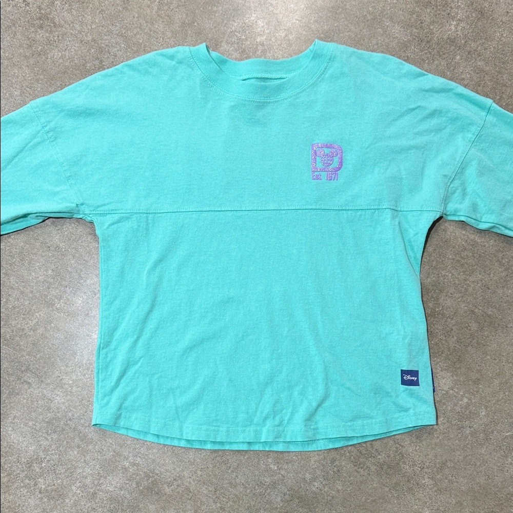 Disney Spirit JerseyAqua Long Sleeve Shirt with Lavender Logo